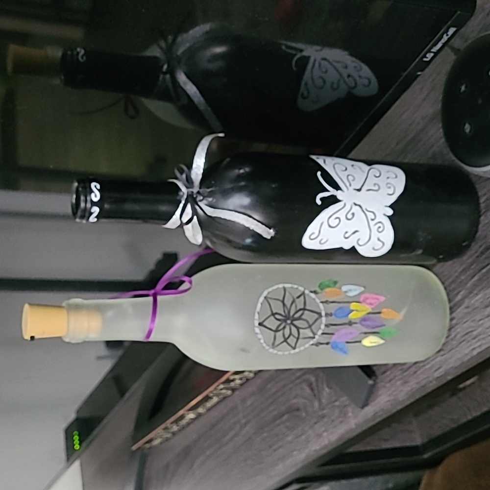 2 hand painted wine bottles